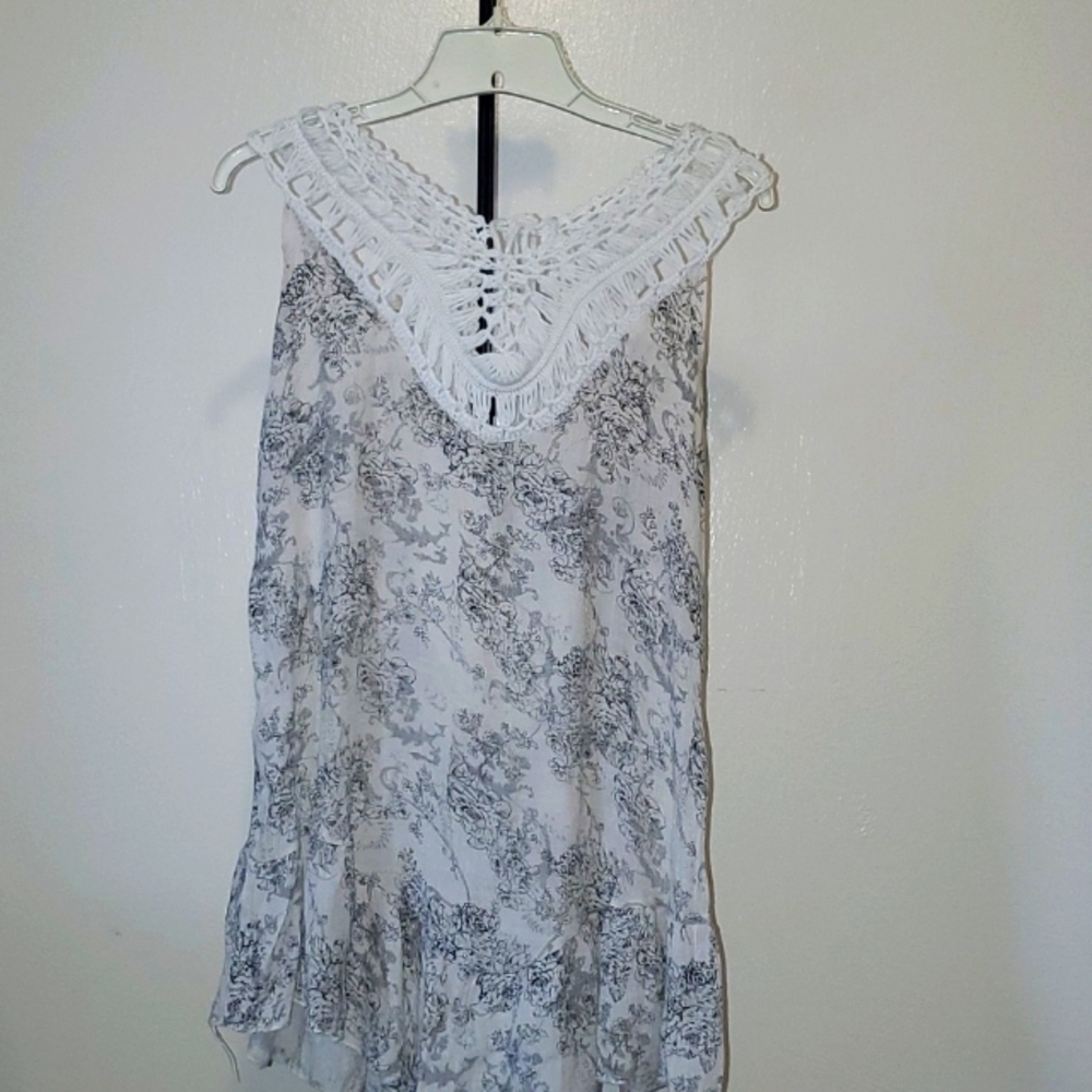 off white and black floral print blouse with a crocheted lace yoke front and bac